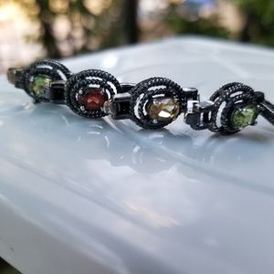 Vintage sterling silver tennis bracelet with multi colored semi precious stones